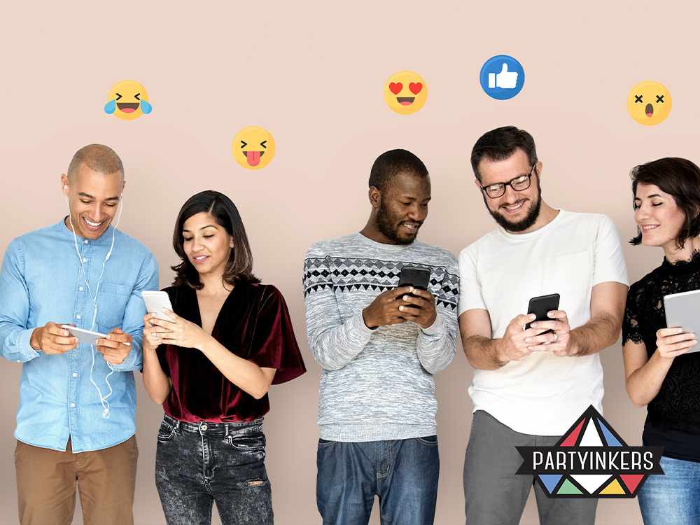 Group of people engaging with their smartphones, surrounded by social media reaction icons, illustrating the importance of creating buzz before, during, and after a product launch.