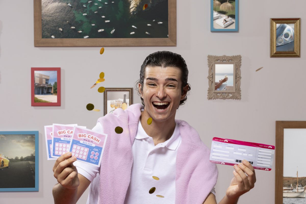 A cheerful man holding raffle tickets and celebrating a win, symbolizing the excitement of raffle draws at Dinner and Dance events. This image represents the 'Raffle Draws with Personalized Corporate Gifts' section, showcasing how personalized rewards can enhance the thrill and engagement of event attendees.