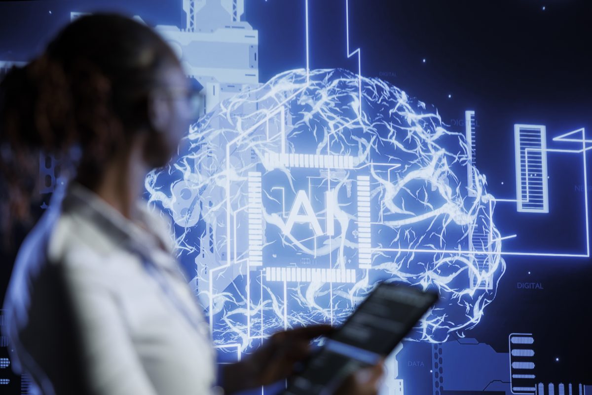 A futuristic depiction of AI technology with a digital brain illustration on a screen, symbolizing the future of personalized events. A blurred figure in the foreground interacts with the technology using a tablet, representing the integration of artificial intelligence in creating tailored event experiences.