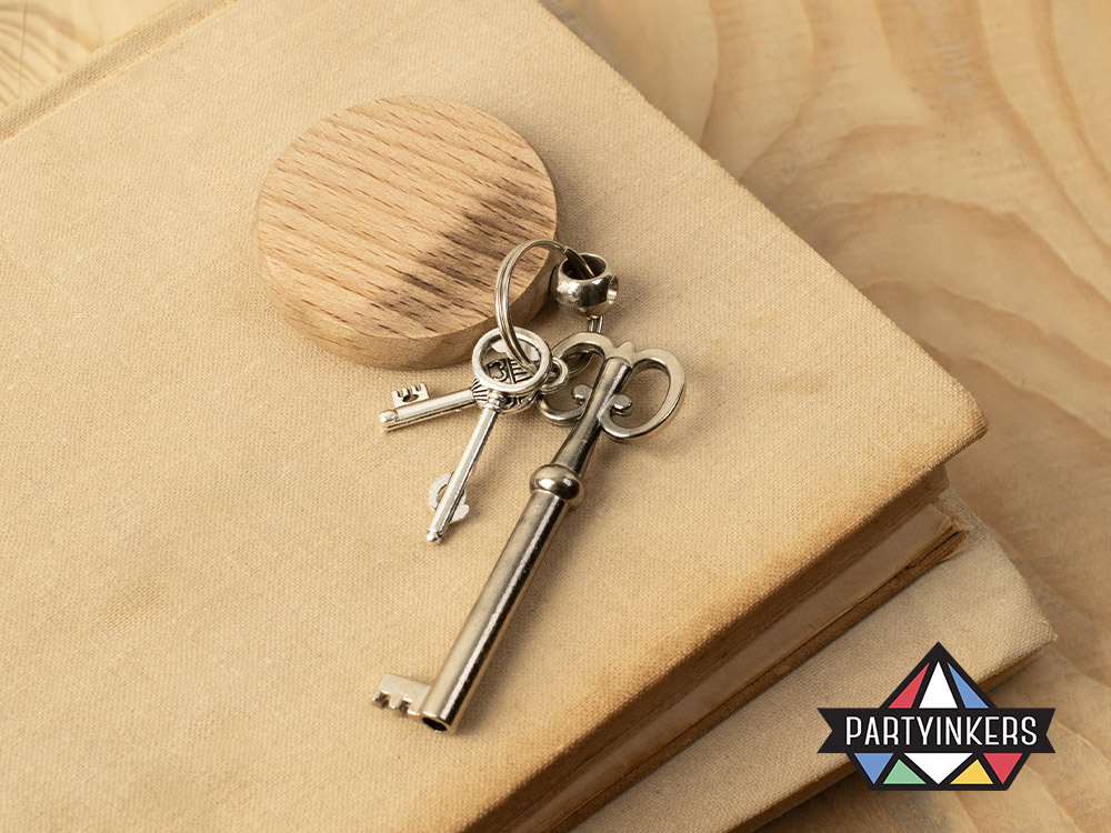 A close-up of a set of keys attached to a laser-engraved wooden keychain as conference gifts for attendees, showcasing the elegant and rustic design, created as part of Partyinkers' live engraving service.