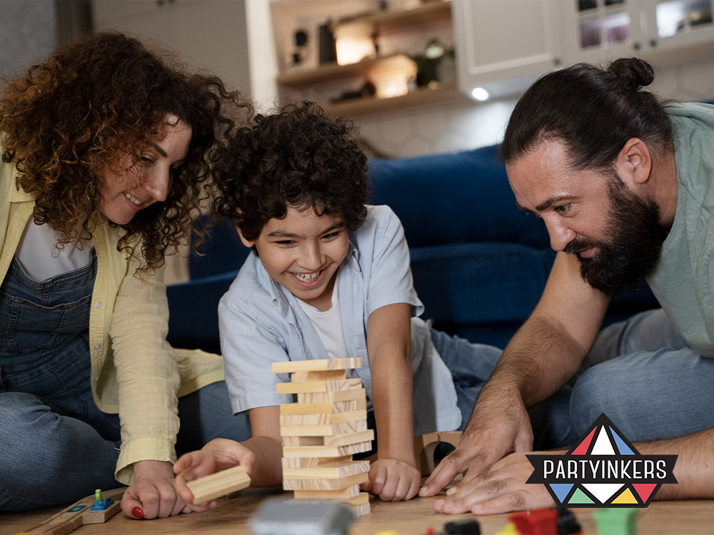 A family enjoying a game of Jenga together during a corporate family day event, showcasing fun activities that engage all generations.