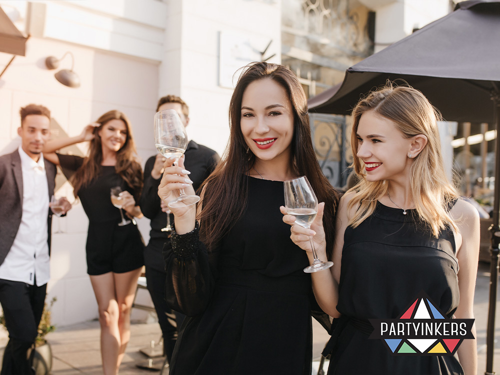Guests enjoying drinks at the arrival reception of a gala dinner, showcasing elegant attire and a sophisticated atmosphere, setting the tone for the evening's event activities.