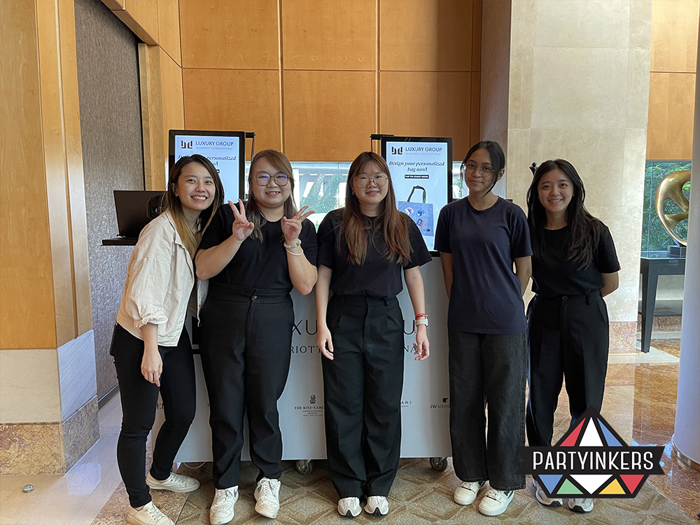 Partyinkers team offering live customization services as part of the gala dinner event activities, providing interactive entertainment and personalized experiences for guests.