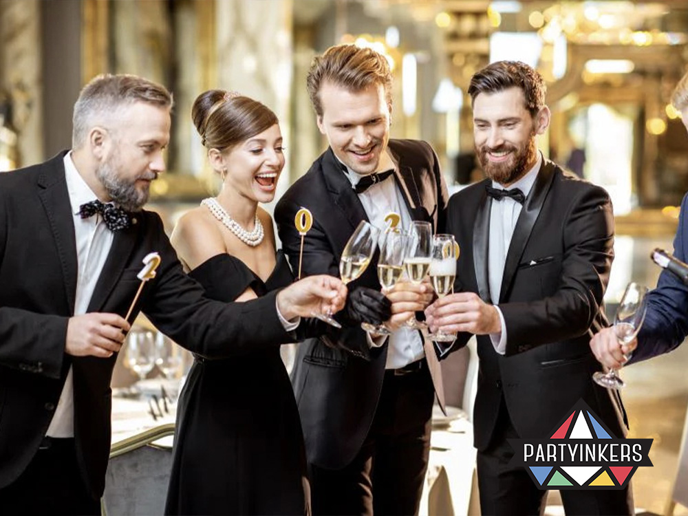 Gala dinner attendees dressed in formal attire enjoying a team-building toast, showcasing the importance of collaborative activities that foster interaction and teamwork.