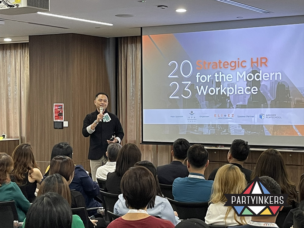 A speaker addressing attendees during an AMA (Ask Me Anything) session at a conference, demonstrating one of the interactive event ideas where participants can engage directly with experts, fostering an open and engaging dialogue.