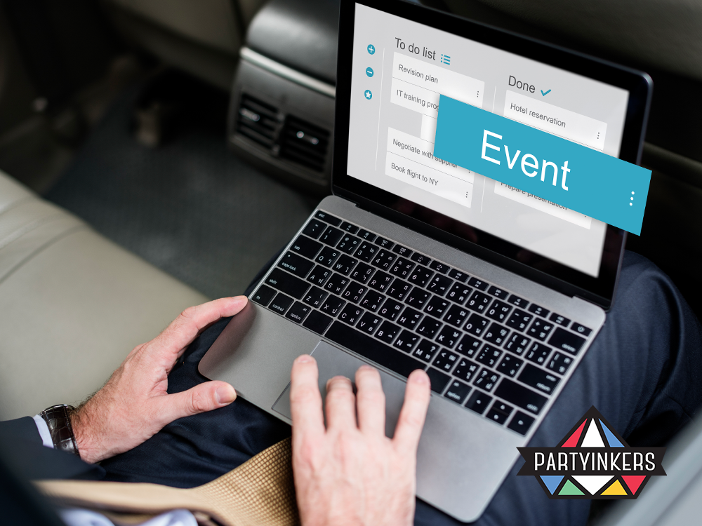 Business executive using a laptop to manage event planning tasks efficiently