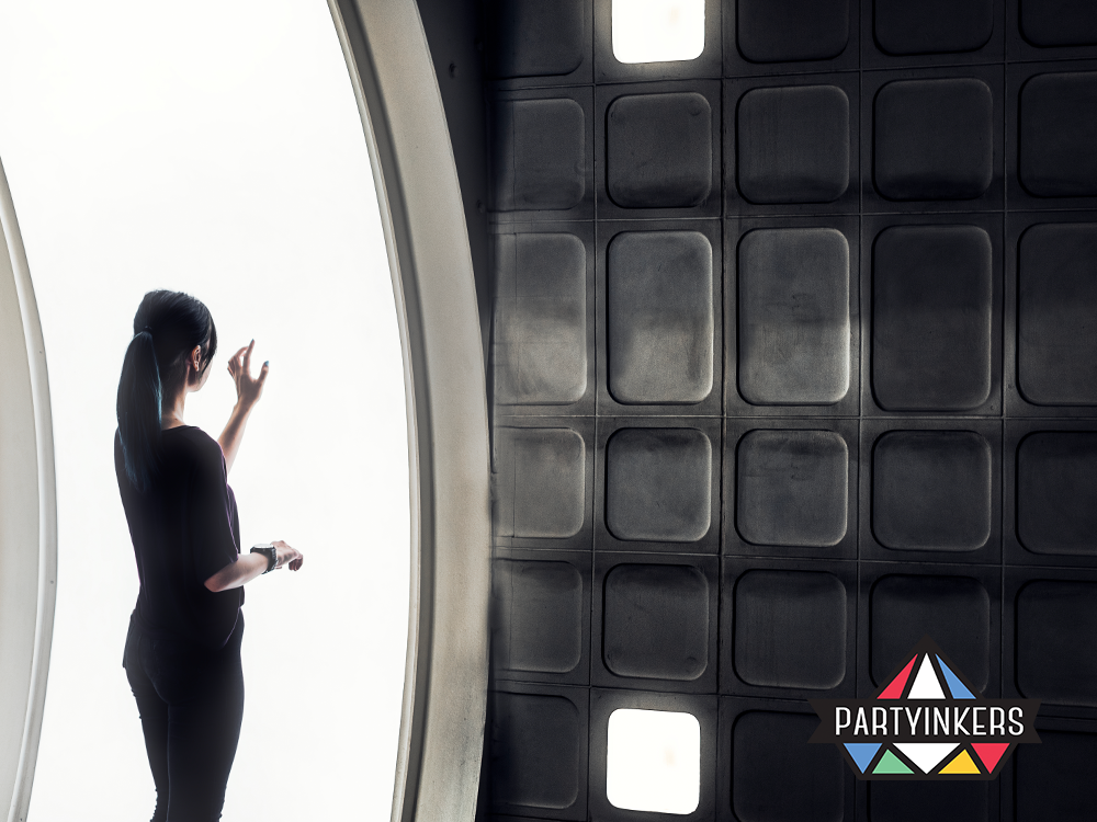 A silhouette of a woman interacting with futuristic technology, symbolizing innovation in event solutions.