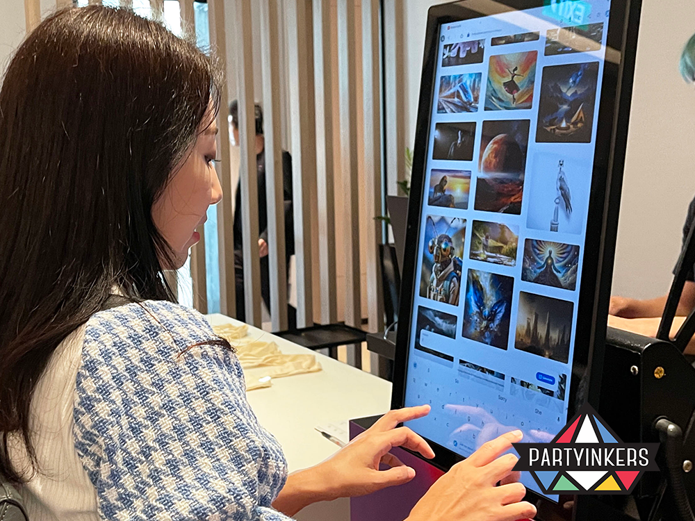 A woman interacts with a digital screen at a custom design station, choosing images for live printing onto bags during a creative event, highlighting user-friendly and innovative technology.