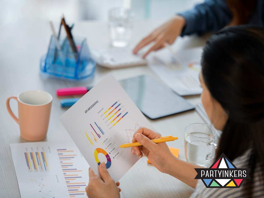 Business professionals analyzing KPI charts and graphs during a corporate planning session.