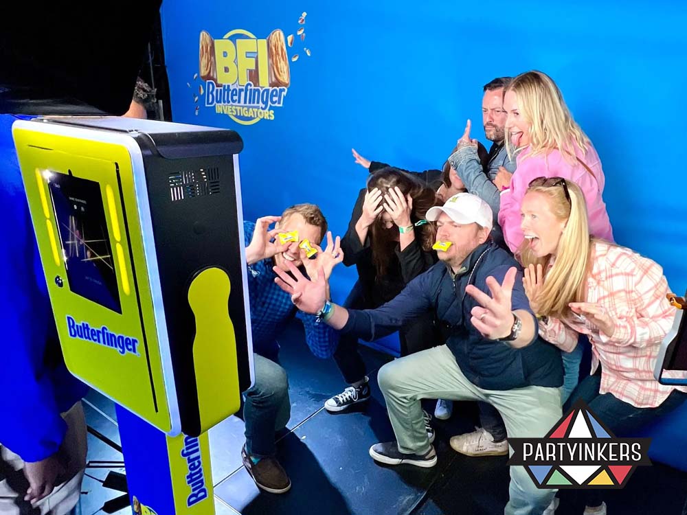 A group of people enthusiastically posing for a photo at the photo booth with fun face expression.