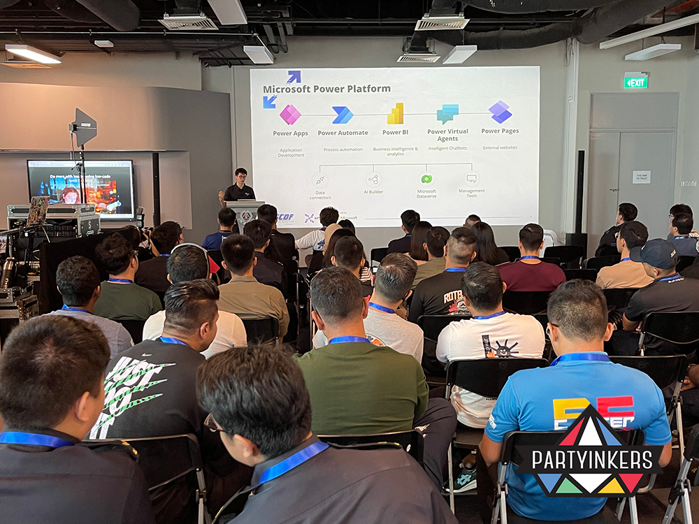 Attendees at the Microsoft Power Platform seminar listen attentively to a presentation on Power Apps, Power Automate, Power BI, and other tools. The session highlights low-code application development, process automation, and data analytics, offering insights to professionals aiming to enhance business efficiency