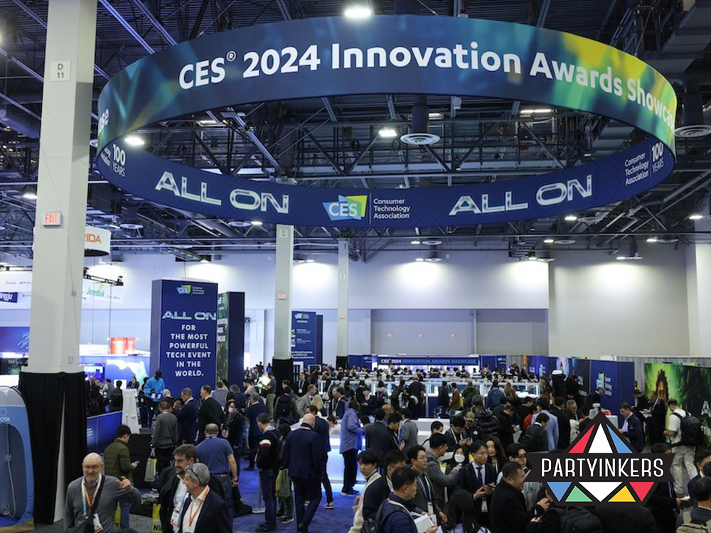 Packed exhibition floor at CES 2024, featuring innovative tech demonstrations as part of exciting conference entertainment ideas.