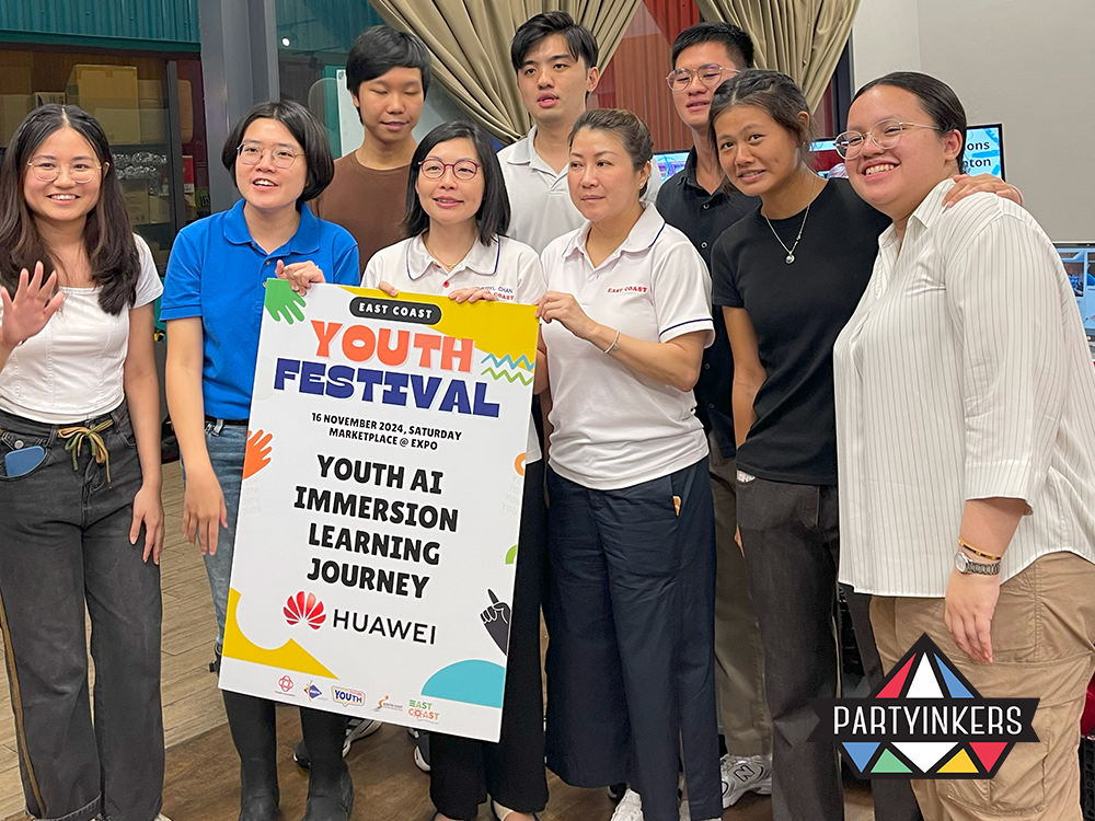 Participants at the Youth Festival posing with a Huawei event banner, highlighting community-driven brand activation ideas that foster youth engagement.