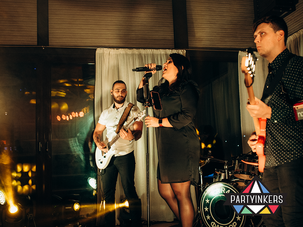 A live musical performance at a conference event, showcasing entertainment ideas for creating a lively and memorable atmosphere.