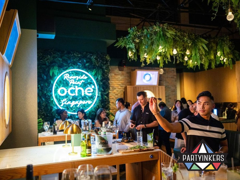 A modern dart bar filled with vibrant neon lighting and lush greenery, providing an engaging social atmosphere for patrons.