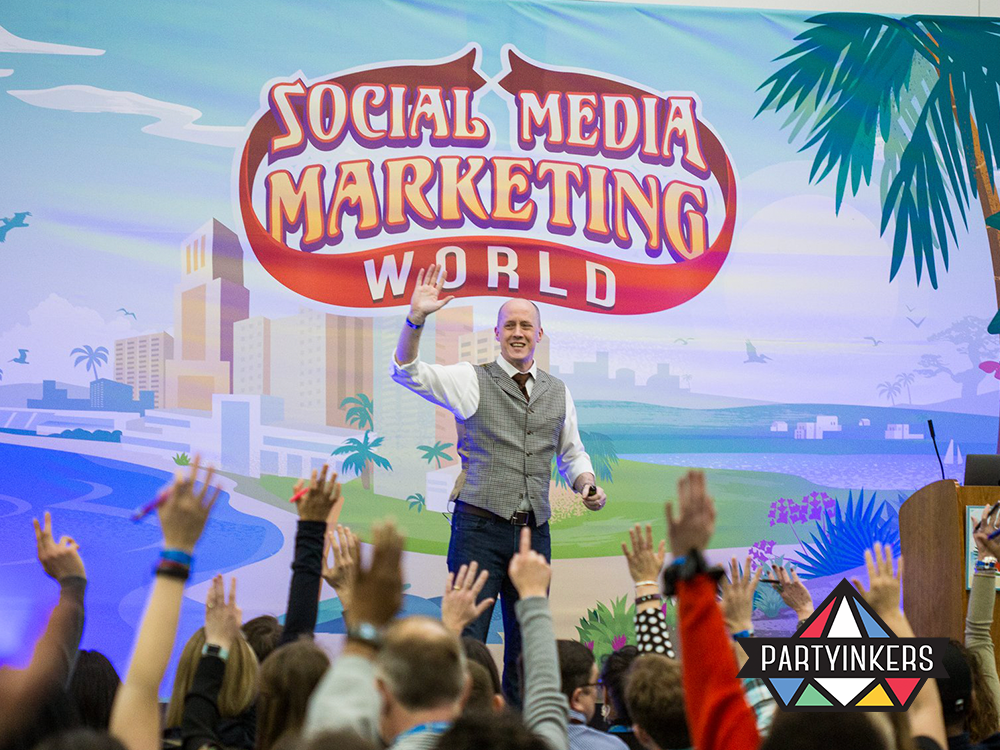 A speaker engaging with the audience at Social Media Marketing World, emphasizing engaging conference entertainment ideas for marketers and professionals.