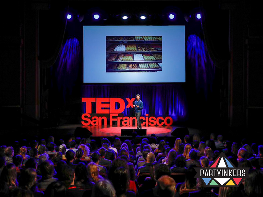 Engaging speaker presentation at TEDx San Francisco, highlighting thought-provoking conference entertainment ideas for intellectual audiences.
