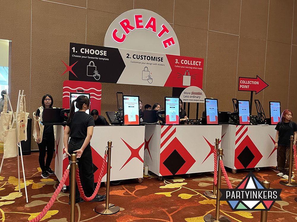 A vibrant "Create" customization booth offering a step-by-step process for attendees to design and collect personalized items.