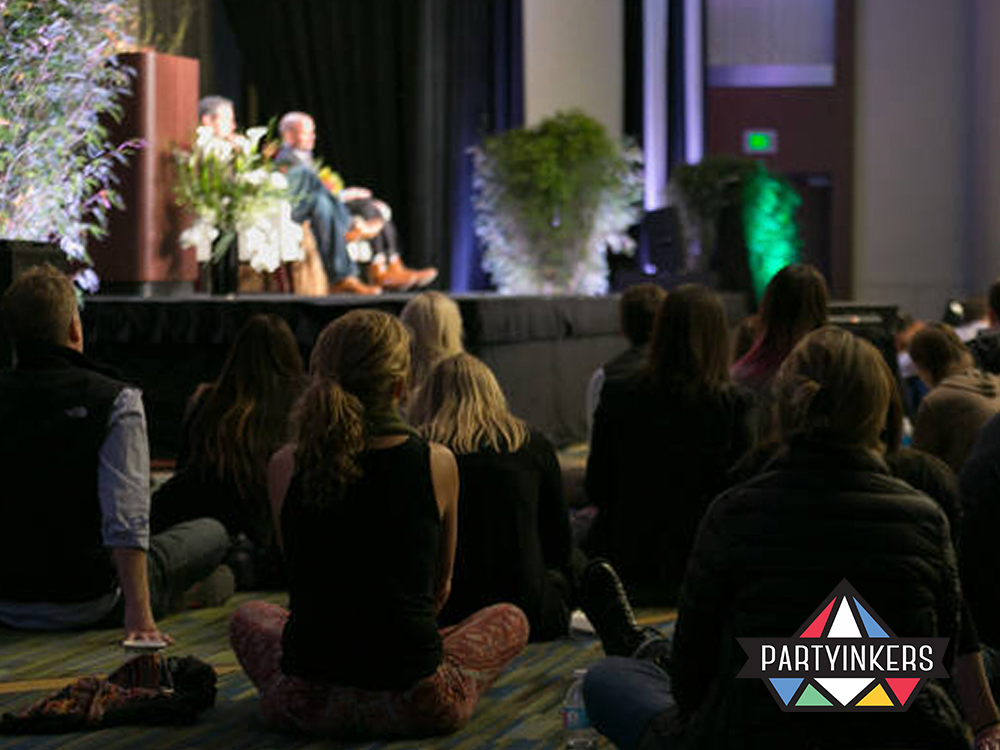 Attendees captivated by a sustainability-focused seminar, representing innovative conference entertainment ideas for eco-conscious events