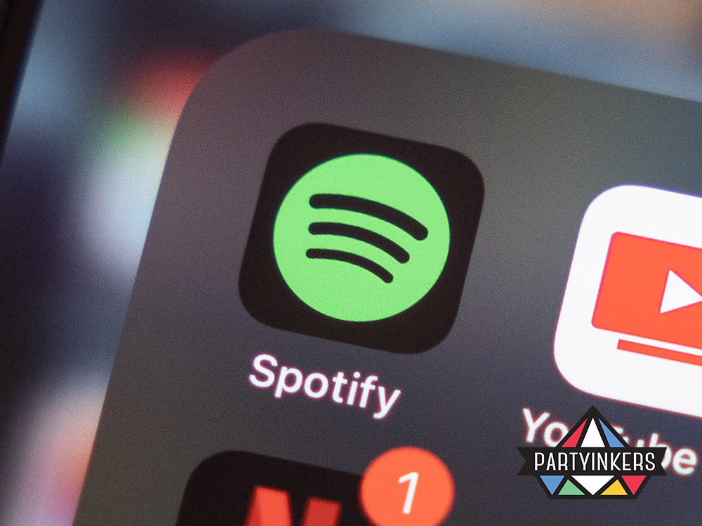 A close-up of the Spotify app icon on a smartphone screen, representing brand activation ideas that enhance digital engagement through music streaming.


