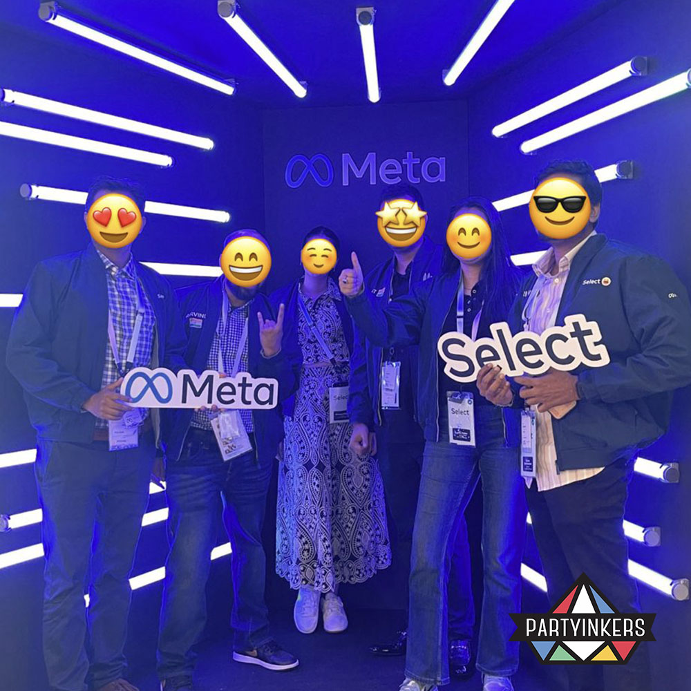 Employees posing with branded signs after executing successful fun company event ideas.