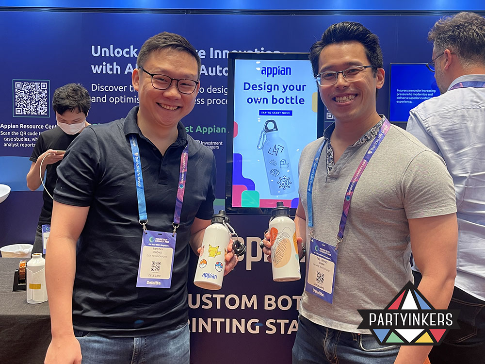 Live printing at events in action as Appian booth visitors showcase personalized bottles—an experiential lead capture strategy at trade shows.